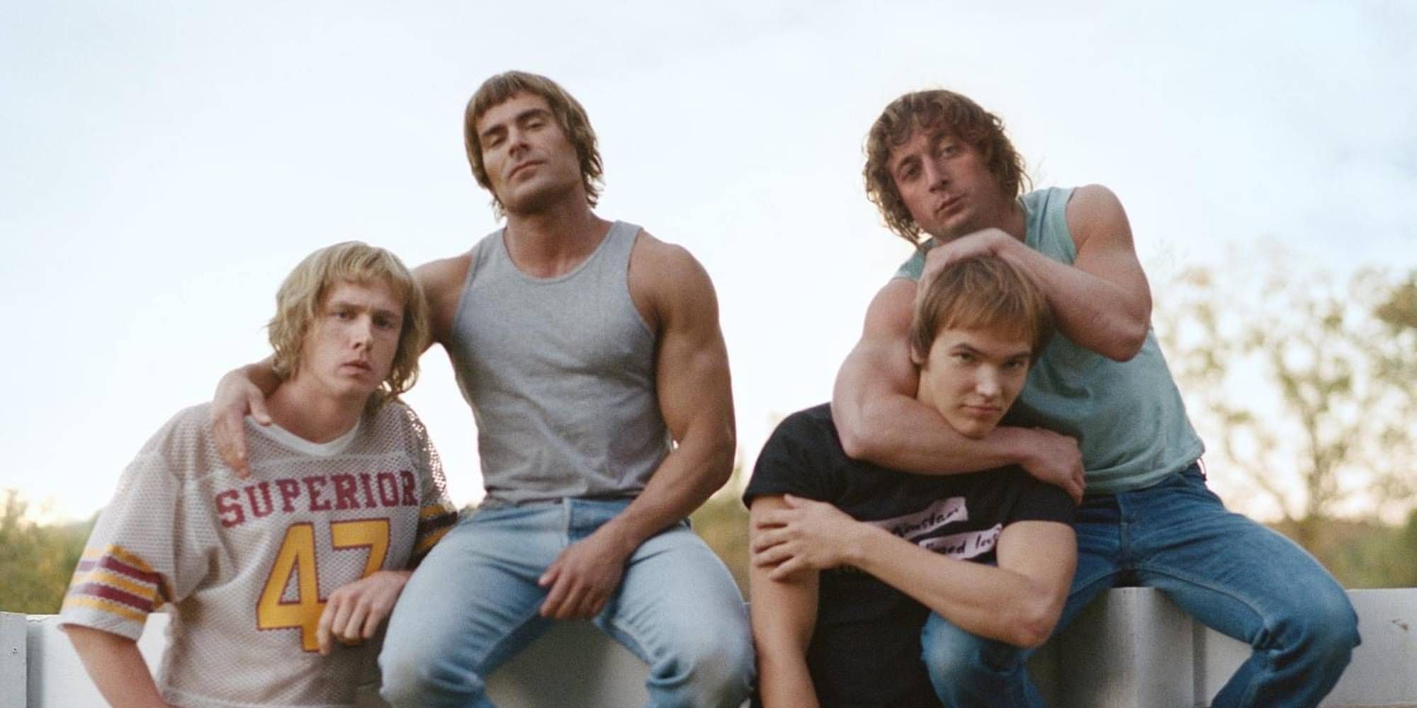 Harris Dickinson, Zac Efron, Jeremy Allen White, and Stanley Simons posing for a group picture Iron Claw