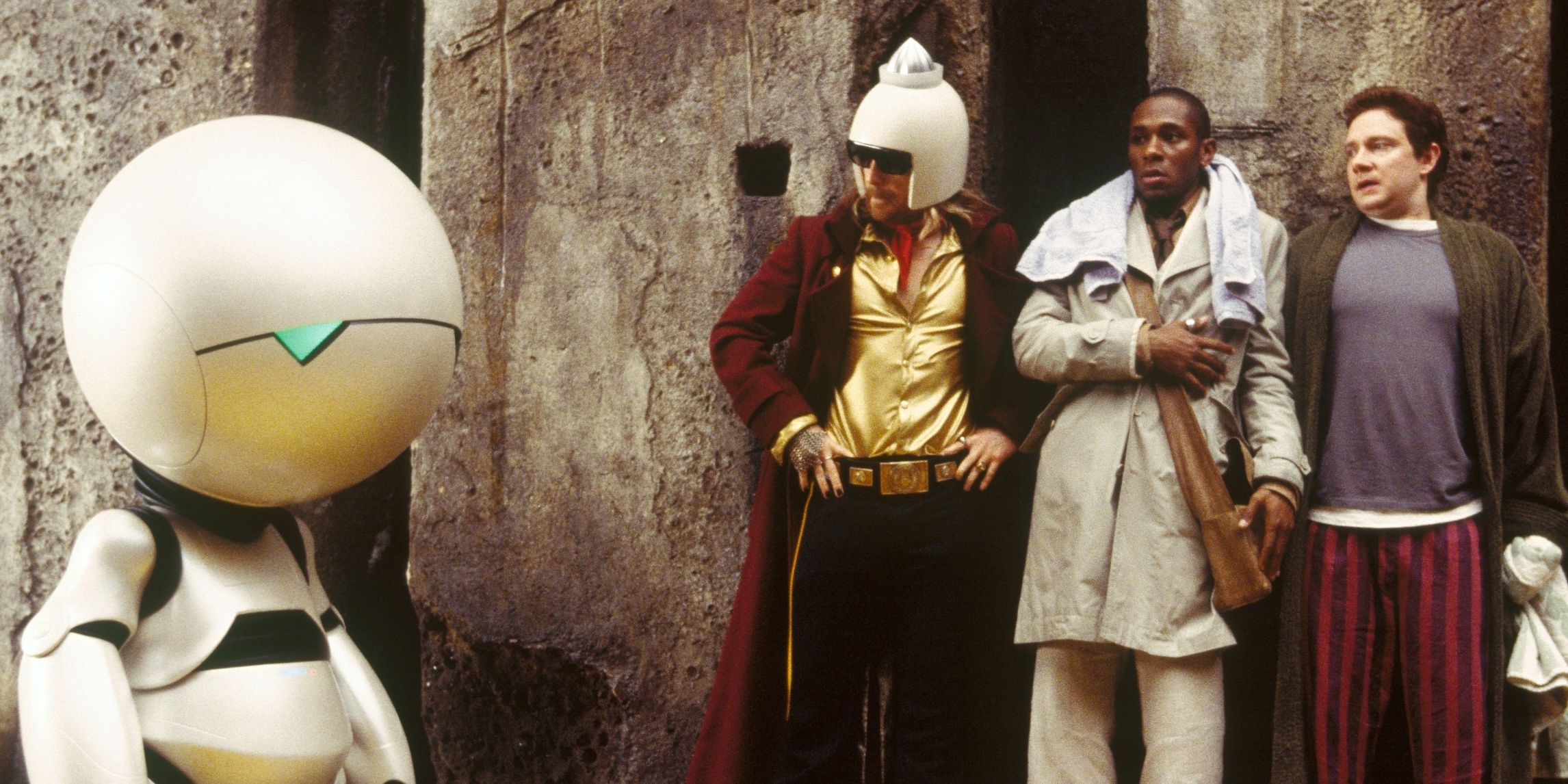 Marvin, Zaphod, Ford, and Arthur hiding in a corridor in hitchhiker's Guide to the Galaxy