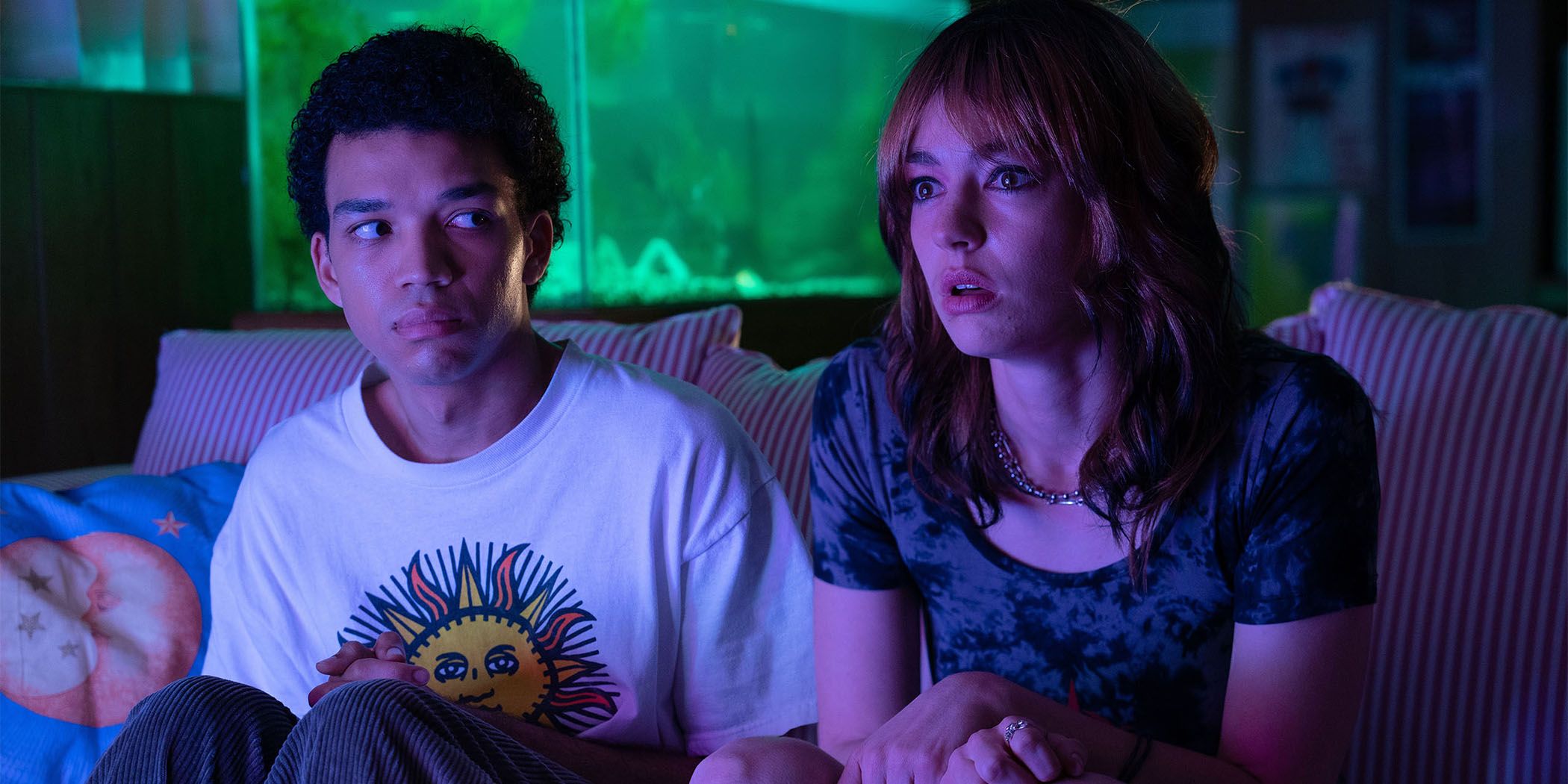 Still of Justice Smith and Brigette Lundy-Paine in front of a TV in I Saw the TV Glow for Sundance 2024.