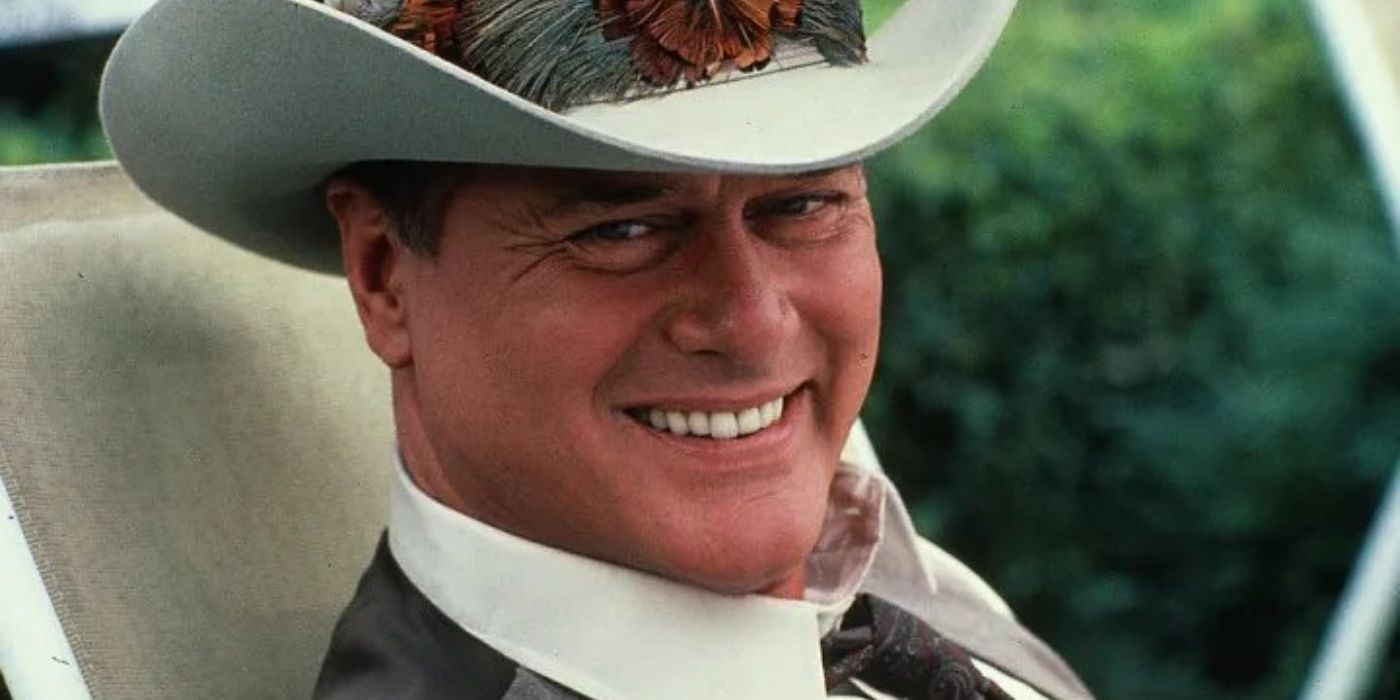 J.R. Ewing in cowboy hat, sitting, smiling at camera