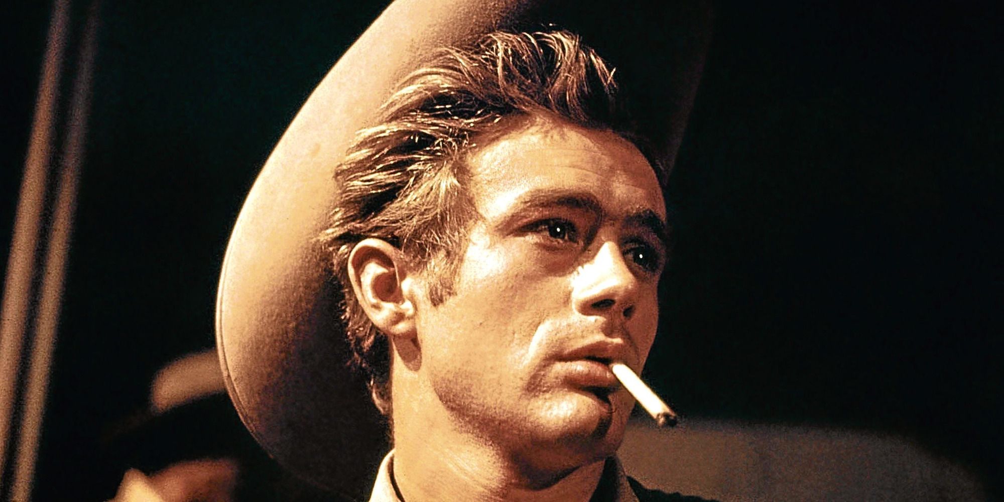 James Dean in a cowboy hat smoking a cigarette