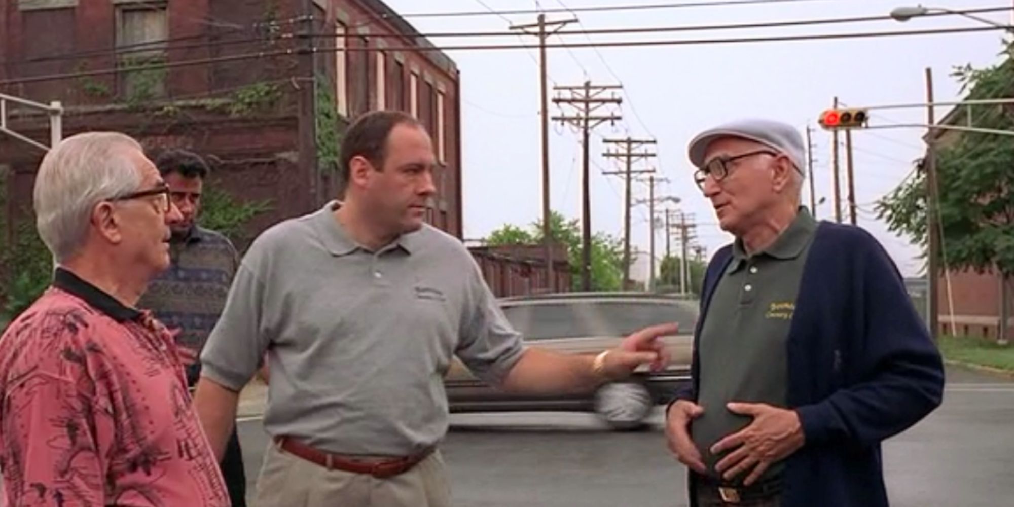 James Gandolfini motioning at Dominic Chianese in the middle of a street in The Sopranos