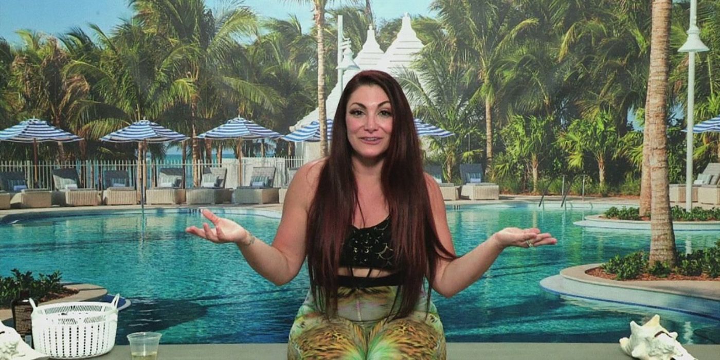 Deena from Jersey Shore: Family Vacation in the Diary Room with her hands out, shoulders shrugged.