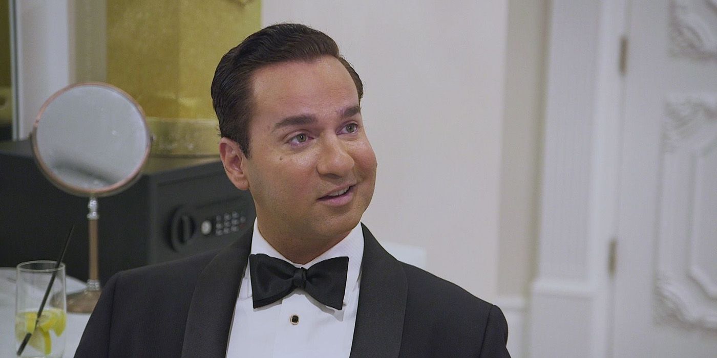 Mike from Jersey Shore: Family Vacation in a suit and bowtie, smiling.