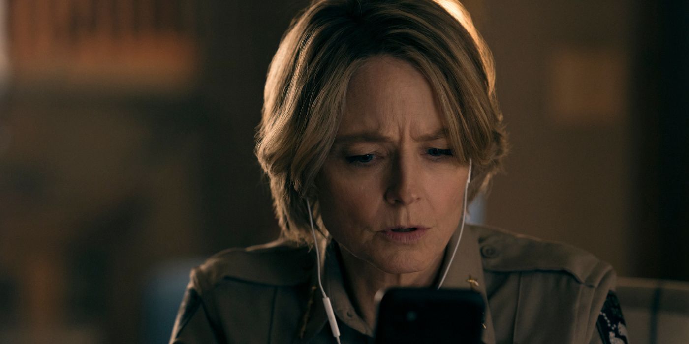 Jodie Foster as Liv Danvers, looking at an iPhone in True Detective: Night Country 