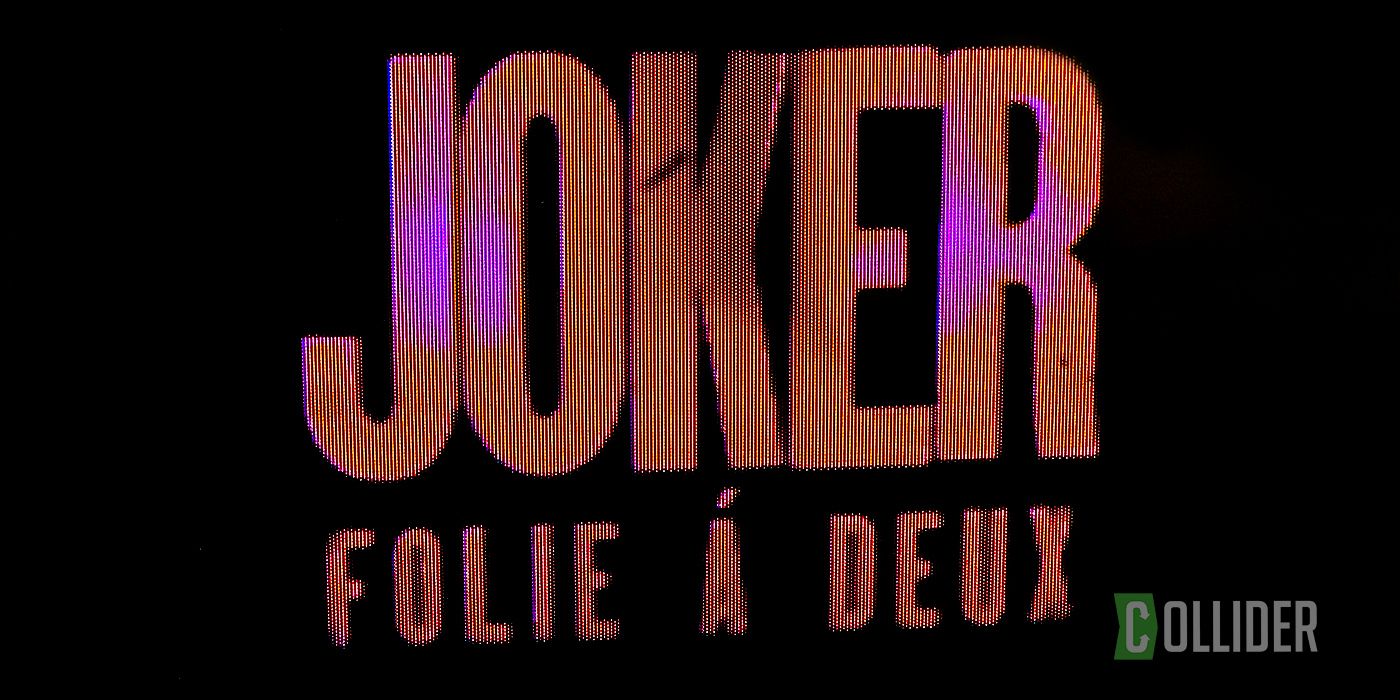 The words Joker: Folie Á Deux in red font on a black background