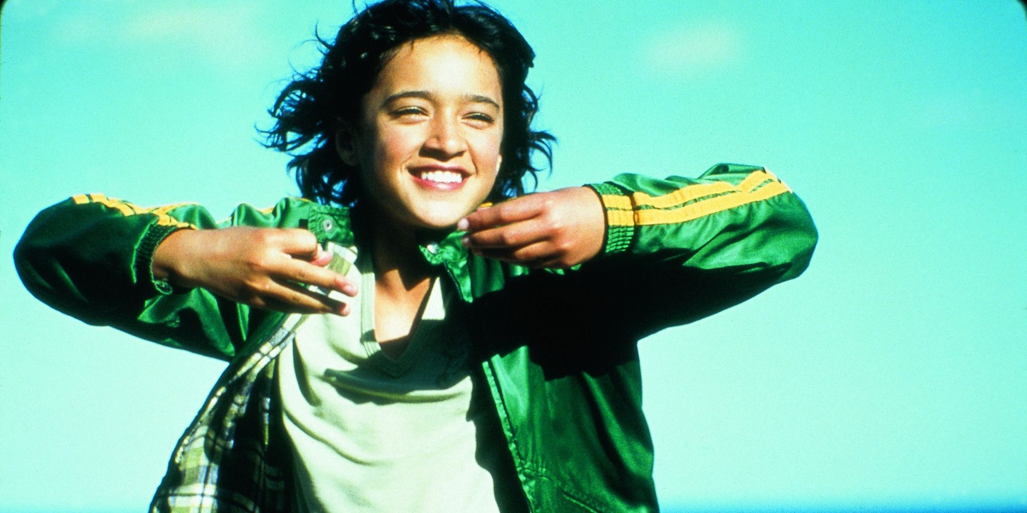 Paikea happily running on the beach in Whale Rider