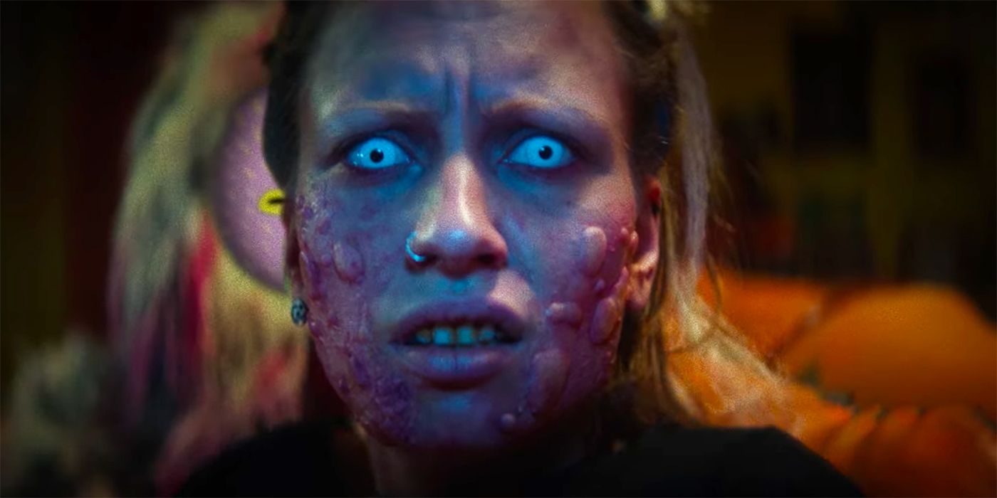 A still of a woman with blue eyes and boils on her face from Kuso