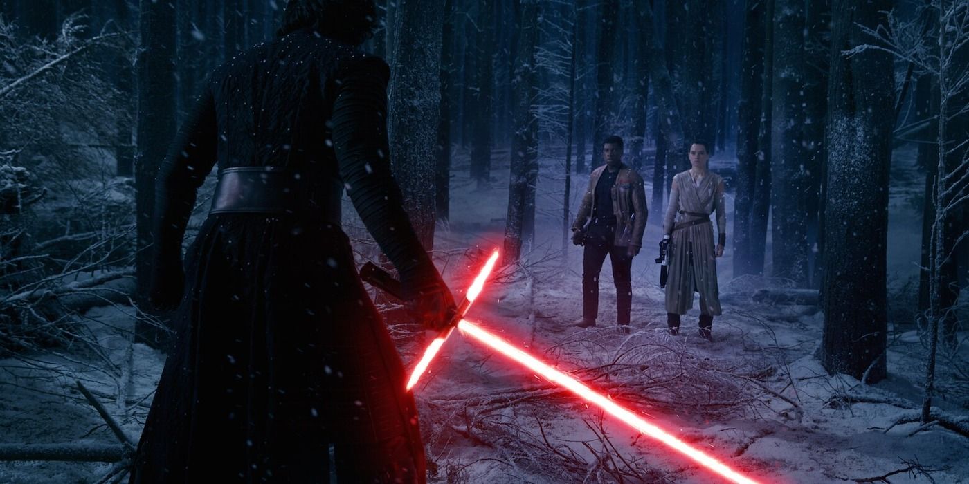 Kylo Ren holding out his lightsaber in Star Wars: The Force Awakens