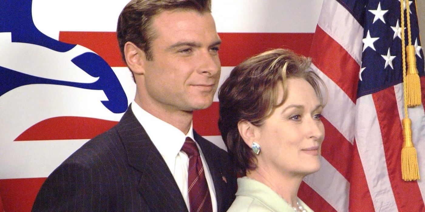 Liev Schreiber and Meryl Streep standing in front of the American flag in 2004's The Manchurian Candidate