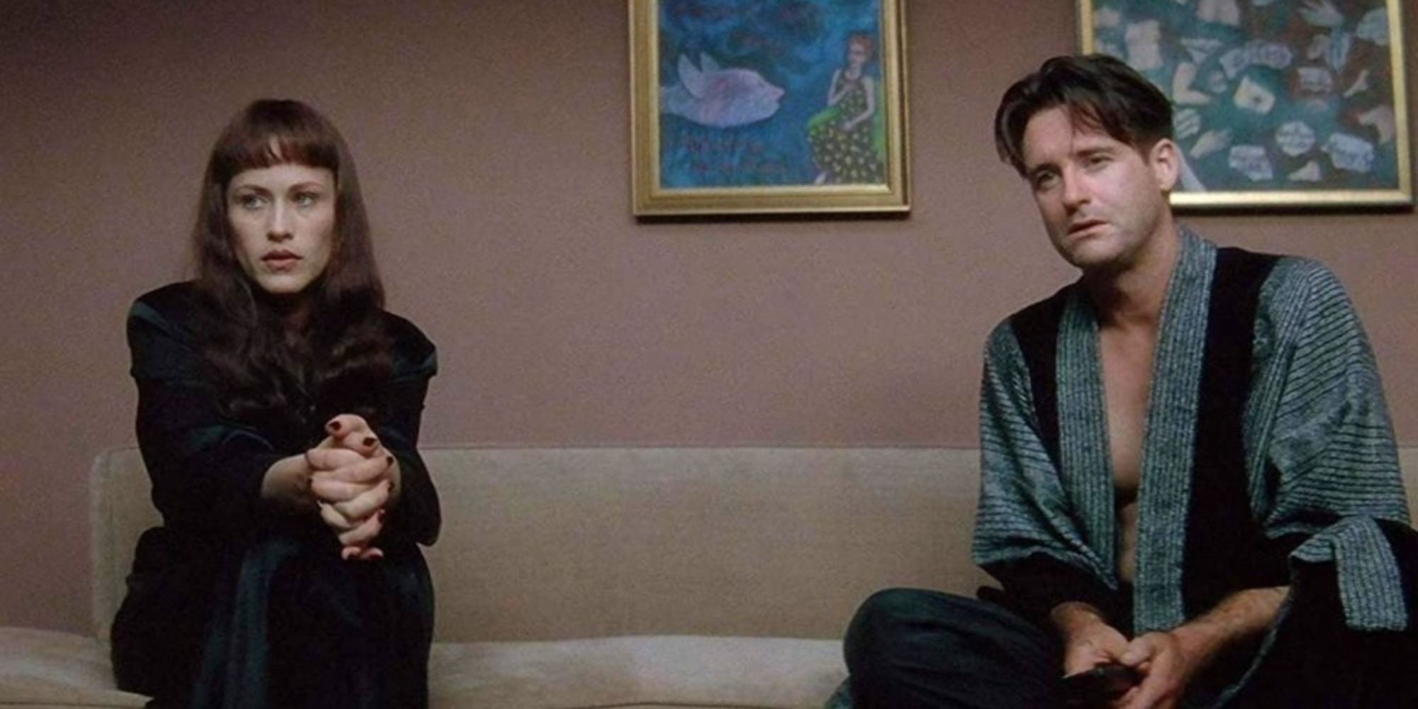 Patricia Arquette and Bill Pullman sitting on a couch in Lost Highway