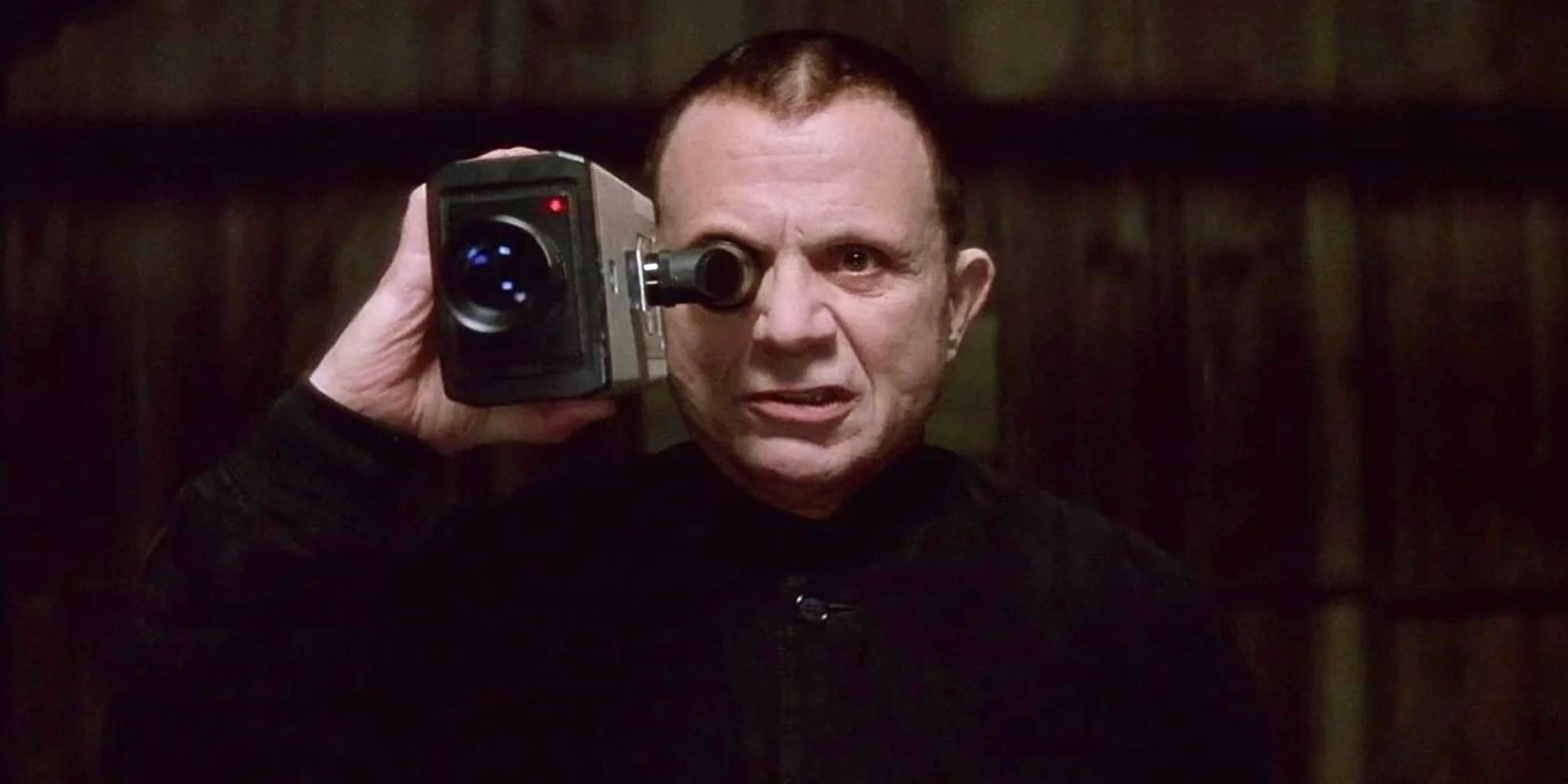 Robert Blake as Mystery Man holding a camcorder in Lost Highway