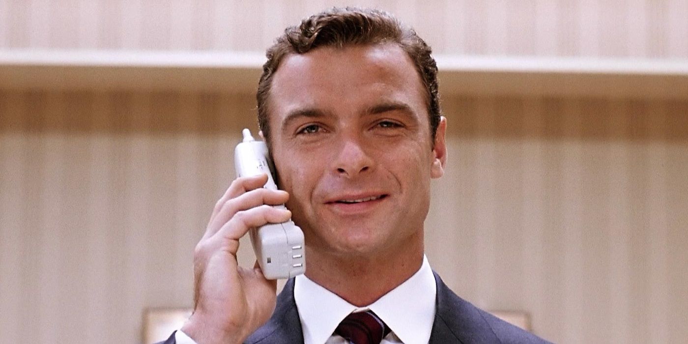 Liev Schreiber as Raymond Shaw smiling while on the phone in 2004's The Manchurian Candidate