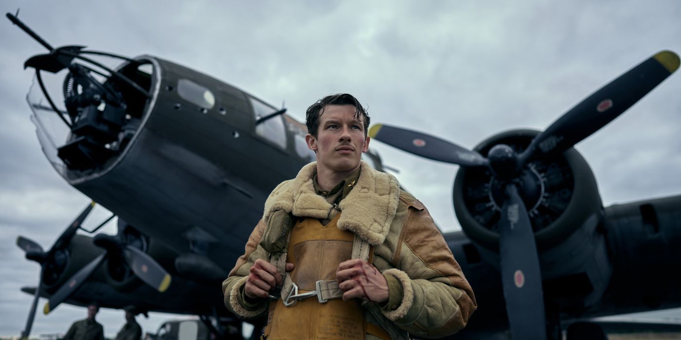 Callum Turner as Major John Egan, standing in front of his plane, in Masters of the Air