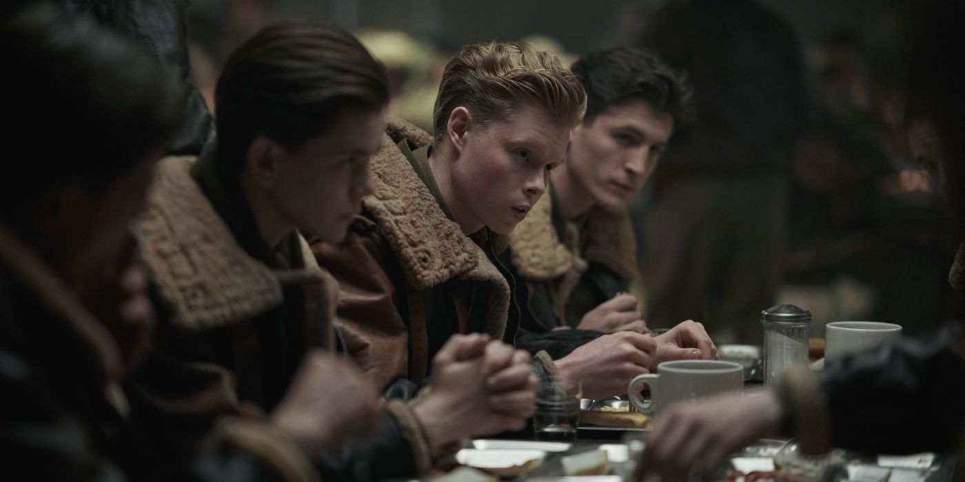 Kai Alexander as Sgt. William Quinn, eating at the barracks, with other soldiers, in Masters of the Air