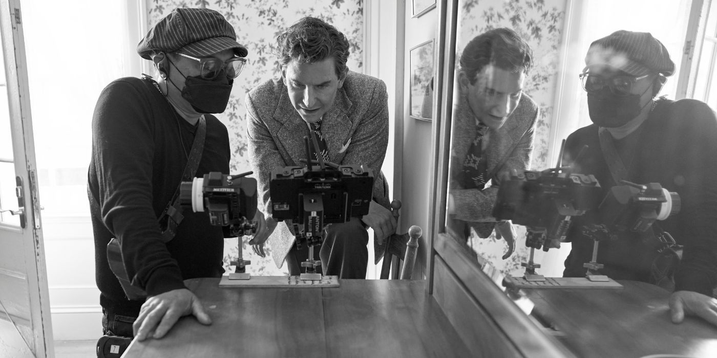 Matthew Libatique and Bradley Cooper, examining a camera, on the set of Maestro