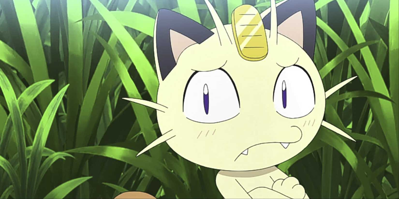 Meowth standing in a field in Pokemon