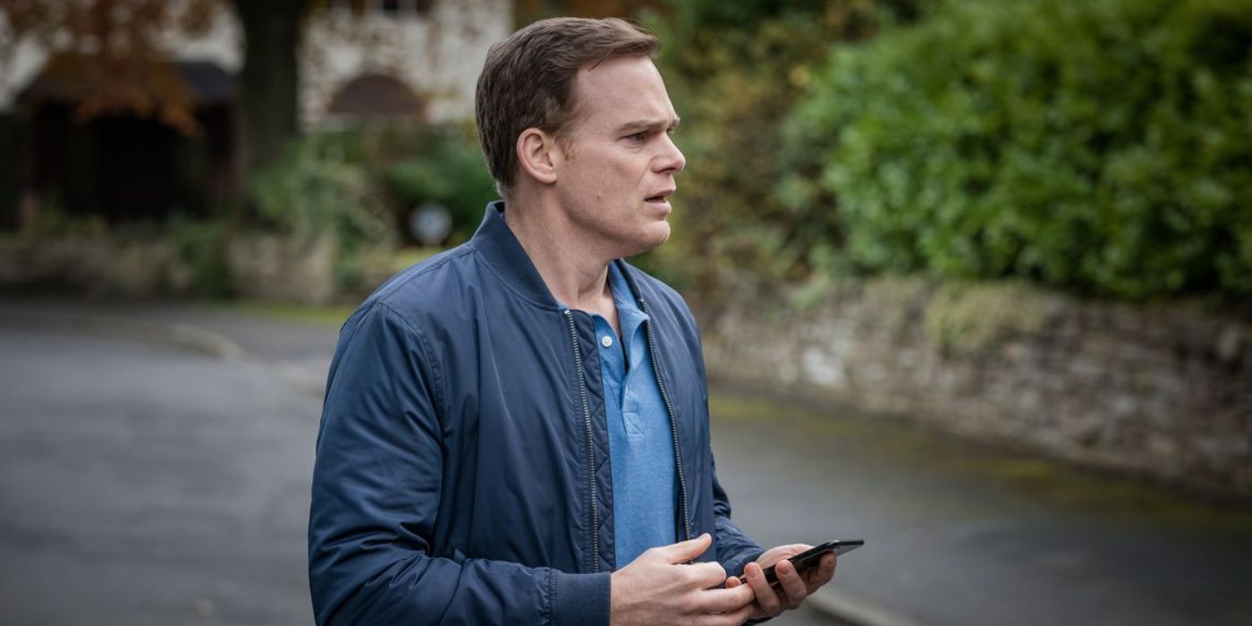 Michael C. Hall in despair while holding his phone in Netflix's 'Safe'