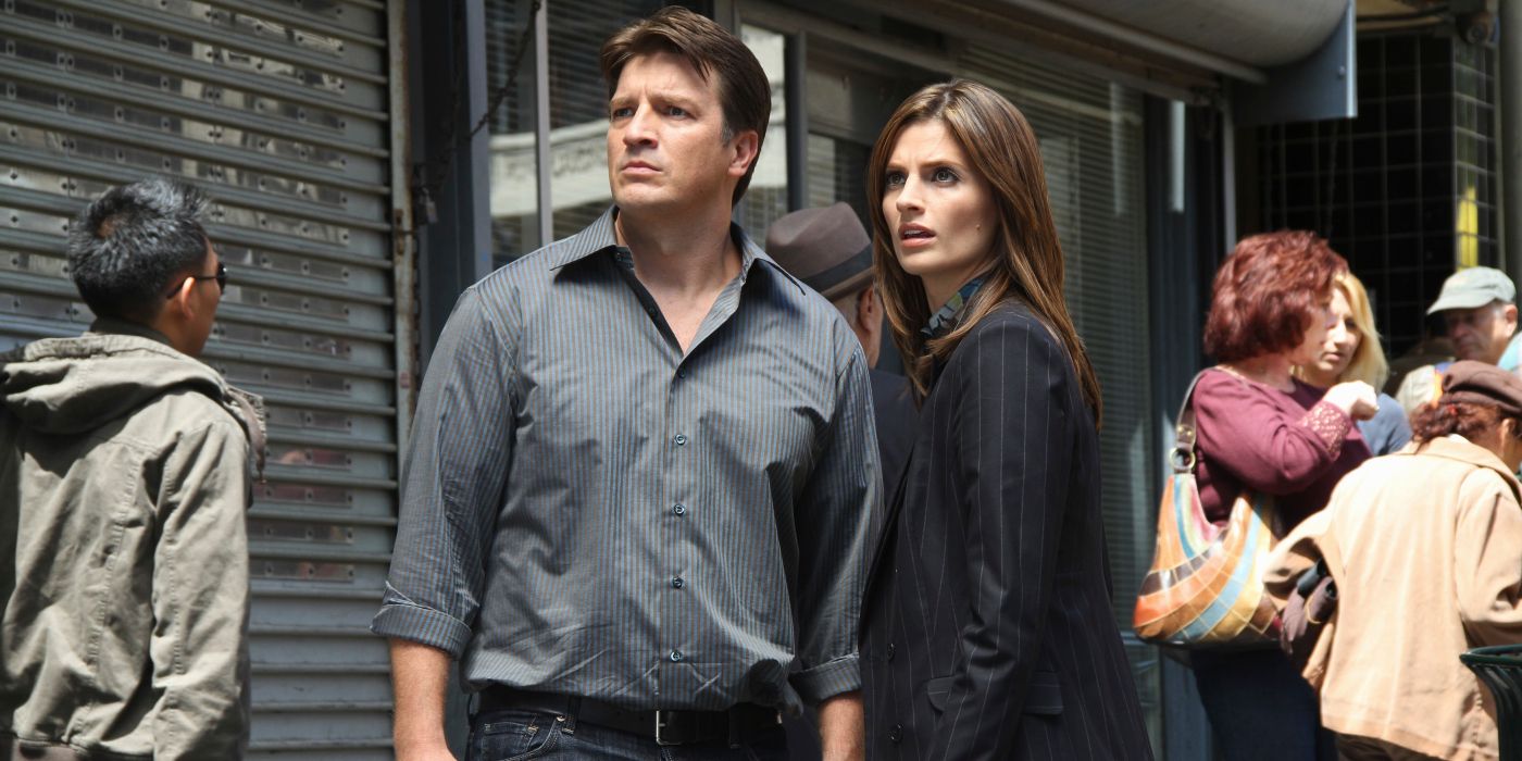 Nathan Fillion as Richard Castle and Stana Katic as Kate Beckett staring in the distance in Castle