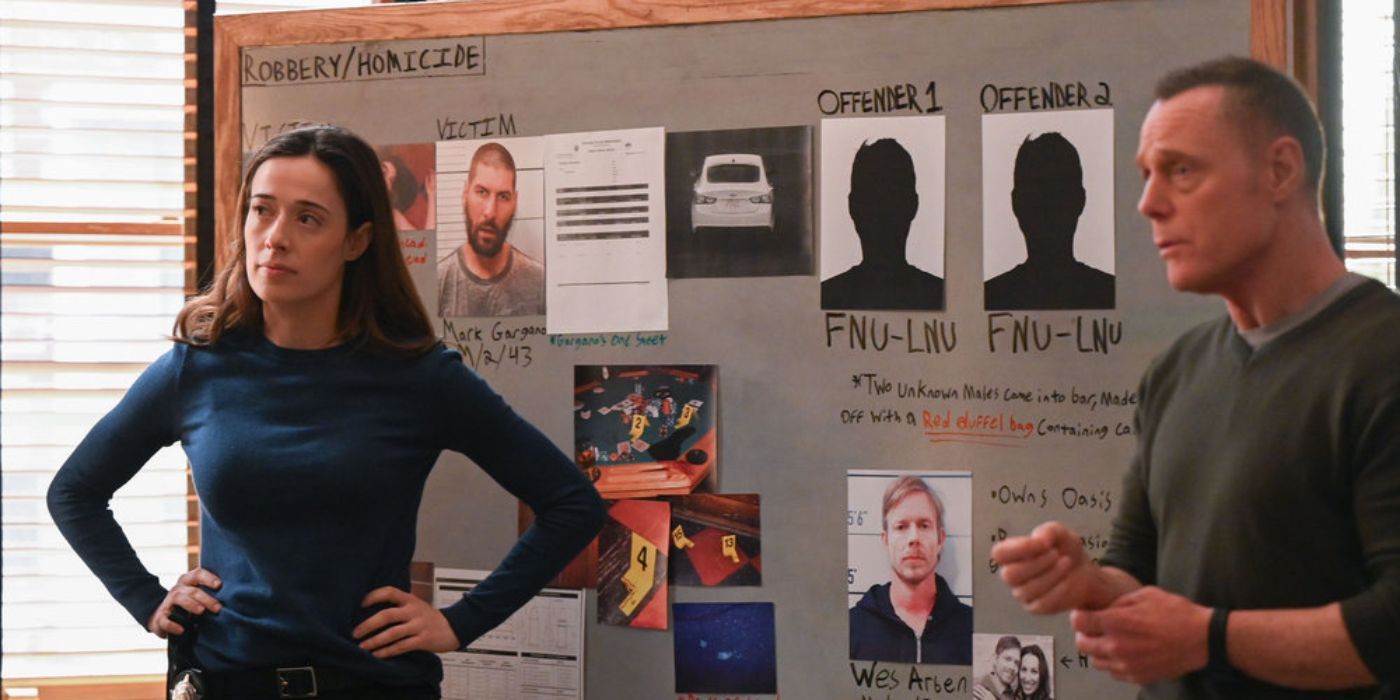 Marina Squerciati and Jason Beghe standing in front of a bulletin board as Kim Burgess and Hank Voight in Chicago PD Season 11