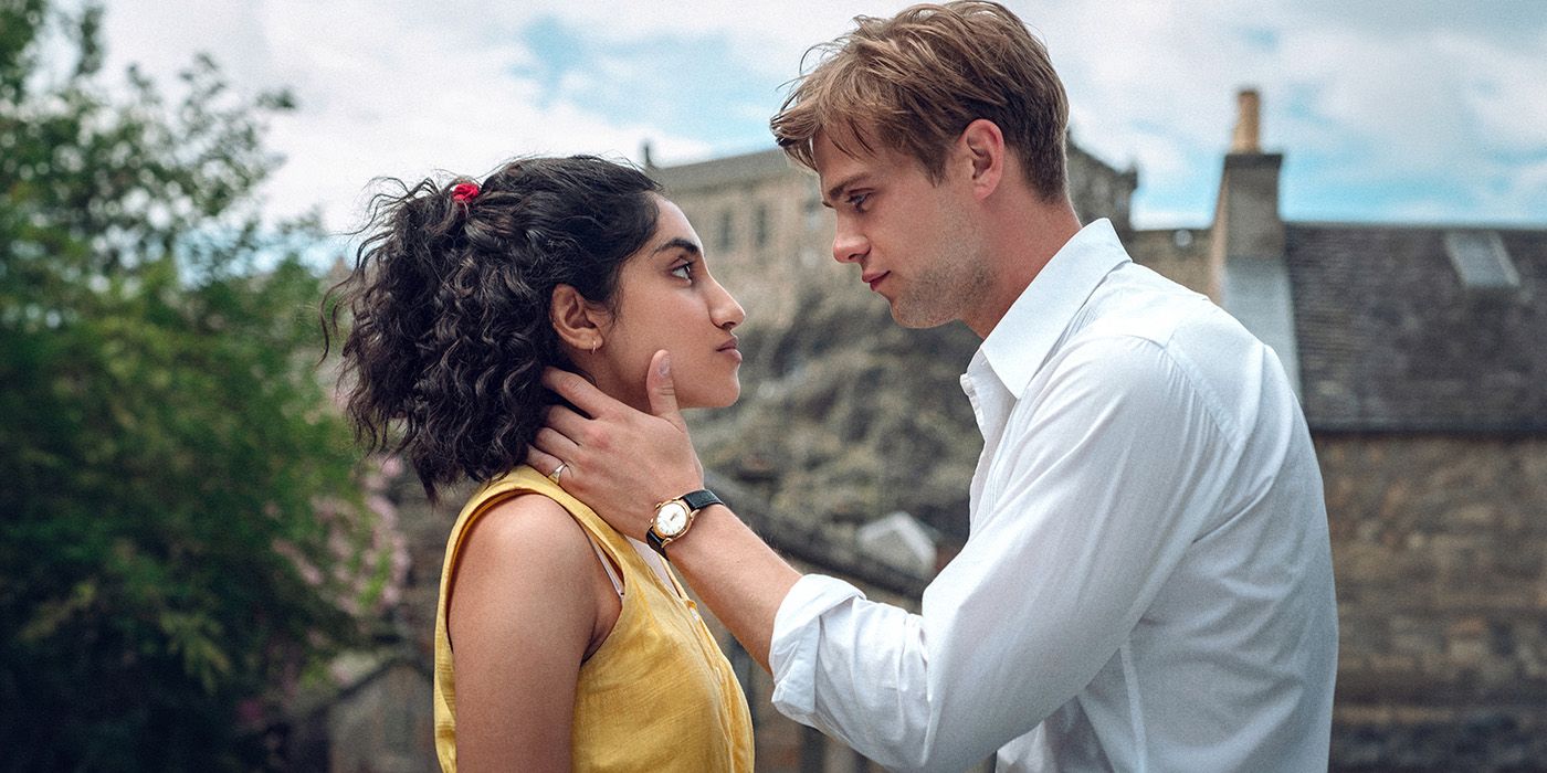 Ambika Mod and Leo Woodall share a romantic moment in a still from One Day. 