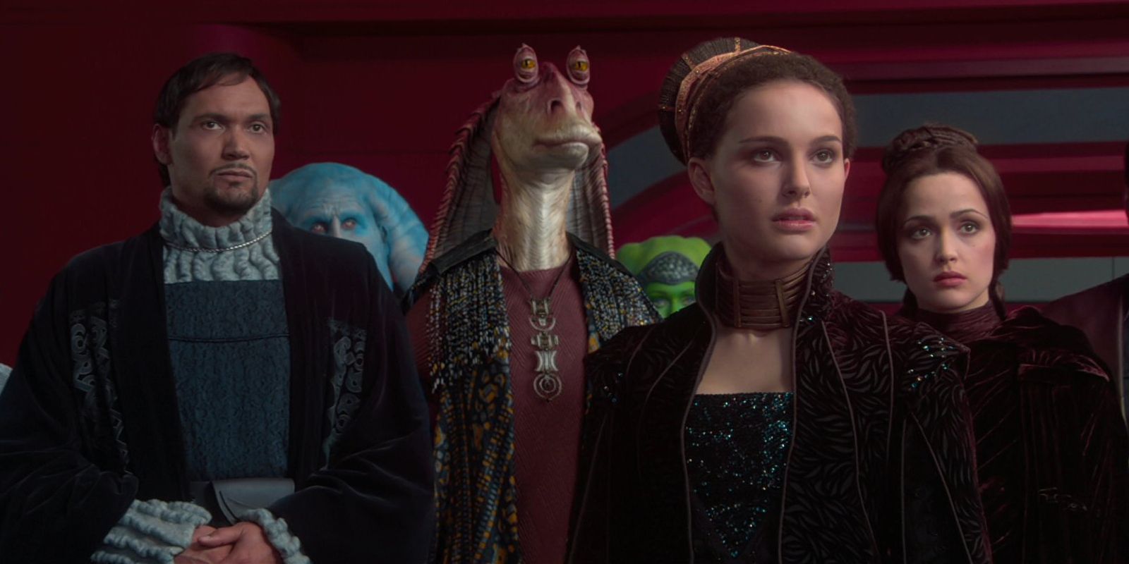 Jar Jar Binks (Ahmed Best), Senator Organa (Jimmy Smits), and Padme Amidala (Natalie Portman) look to plead their case in the senate in Star Wars