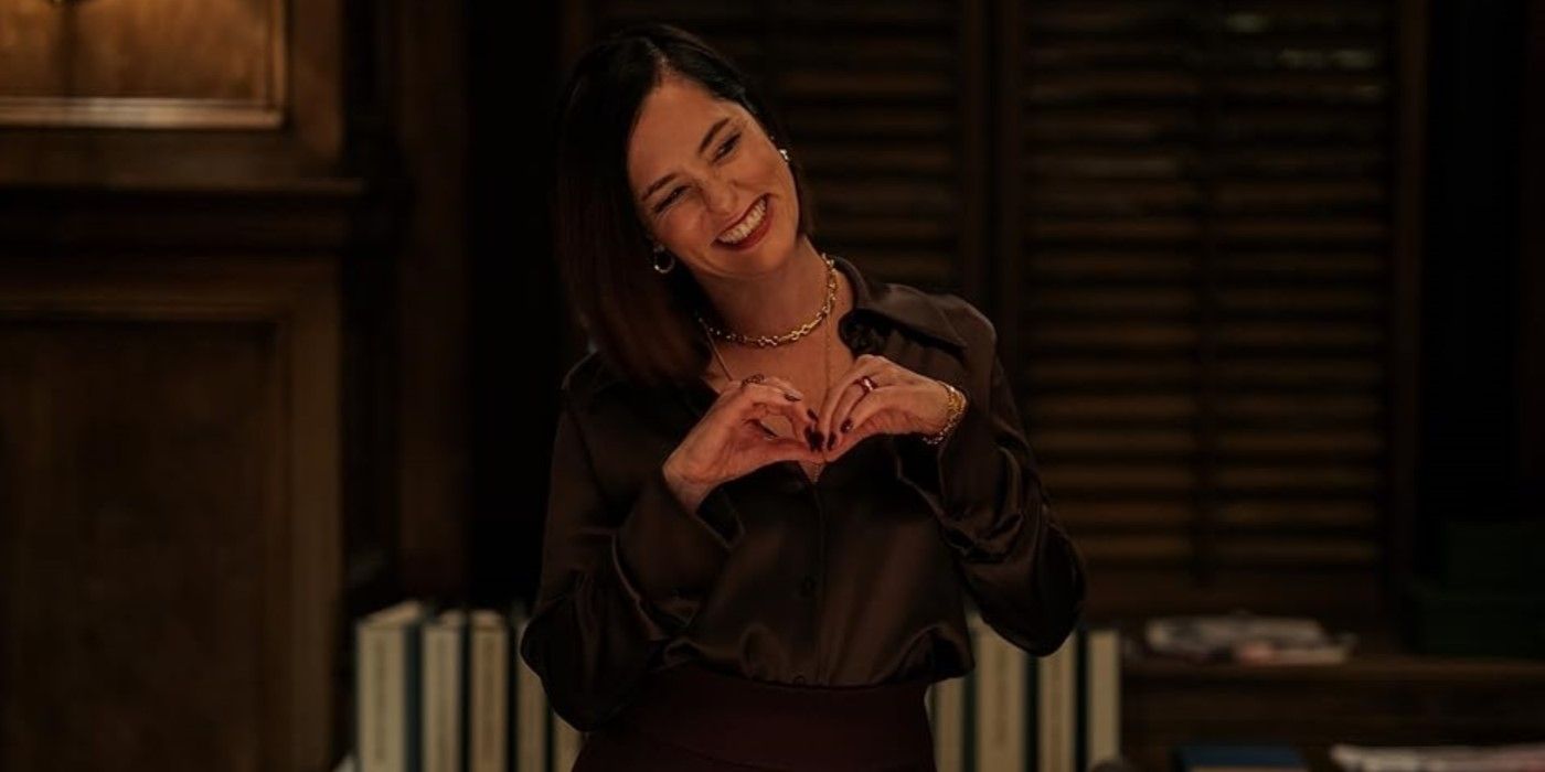 Parker Posey holding her hands up in Mr & Mrs. Smith (2024 TV series)