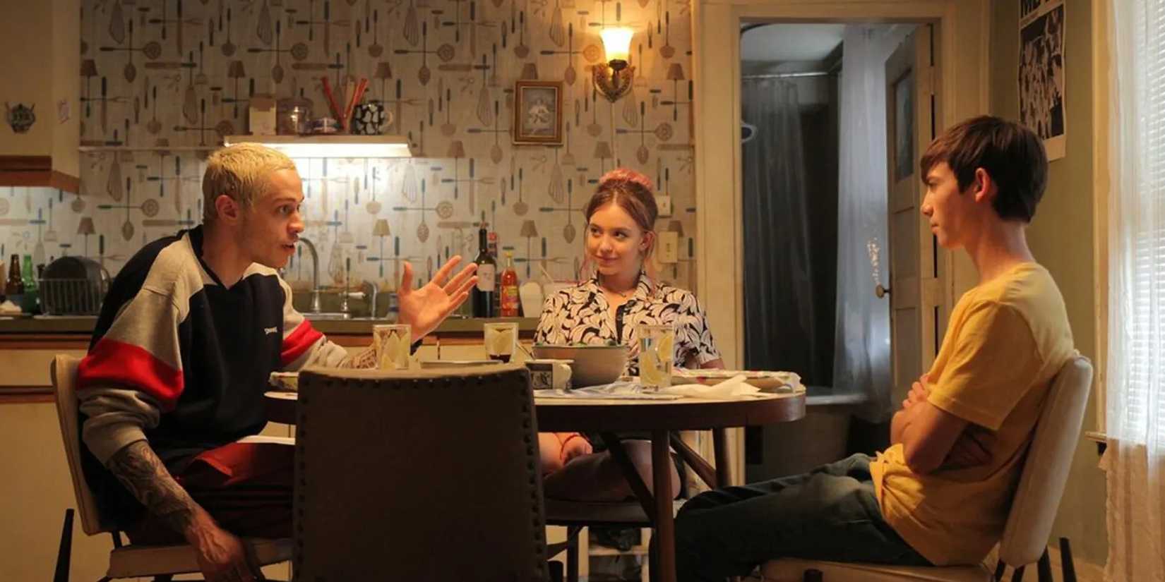 Pete Davidson, Sydney Sweeney and Griffin Gluck sitting at the table and having a conversation in Big Time Adolescence.