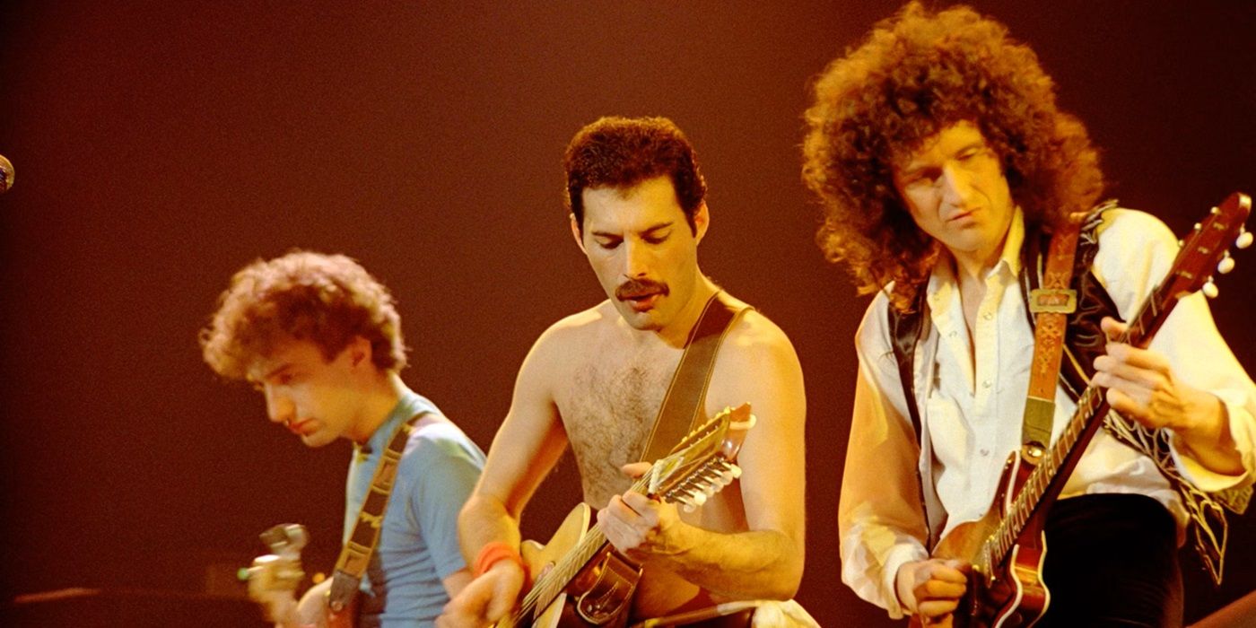 John Deacon, Freddie Mercury, and Brian May performing together in Queen Rock Montreal