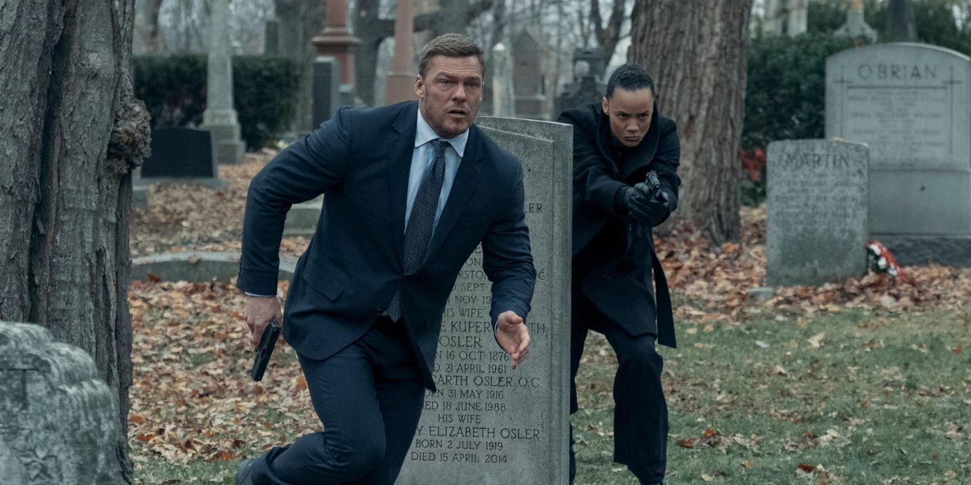 Alan Ritchson and Maria Sten, wielding pistols, while running through a cemetary in Reacher Season 2