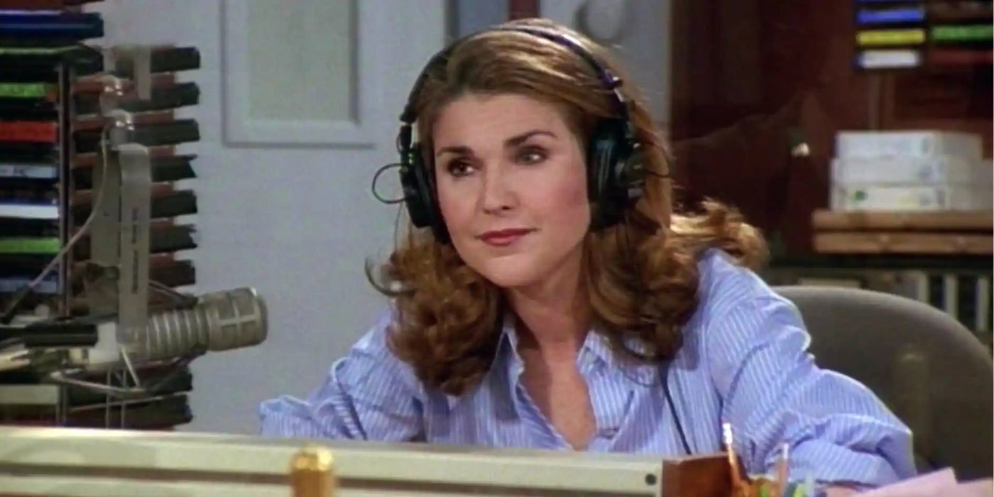 Roz (Peri Gilpin) wearing headphones and sitting in a chair, producing one of Frasier's radio shows on Frasier