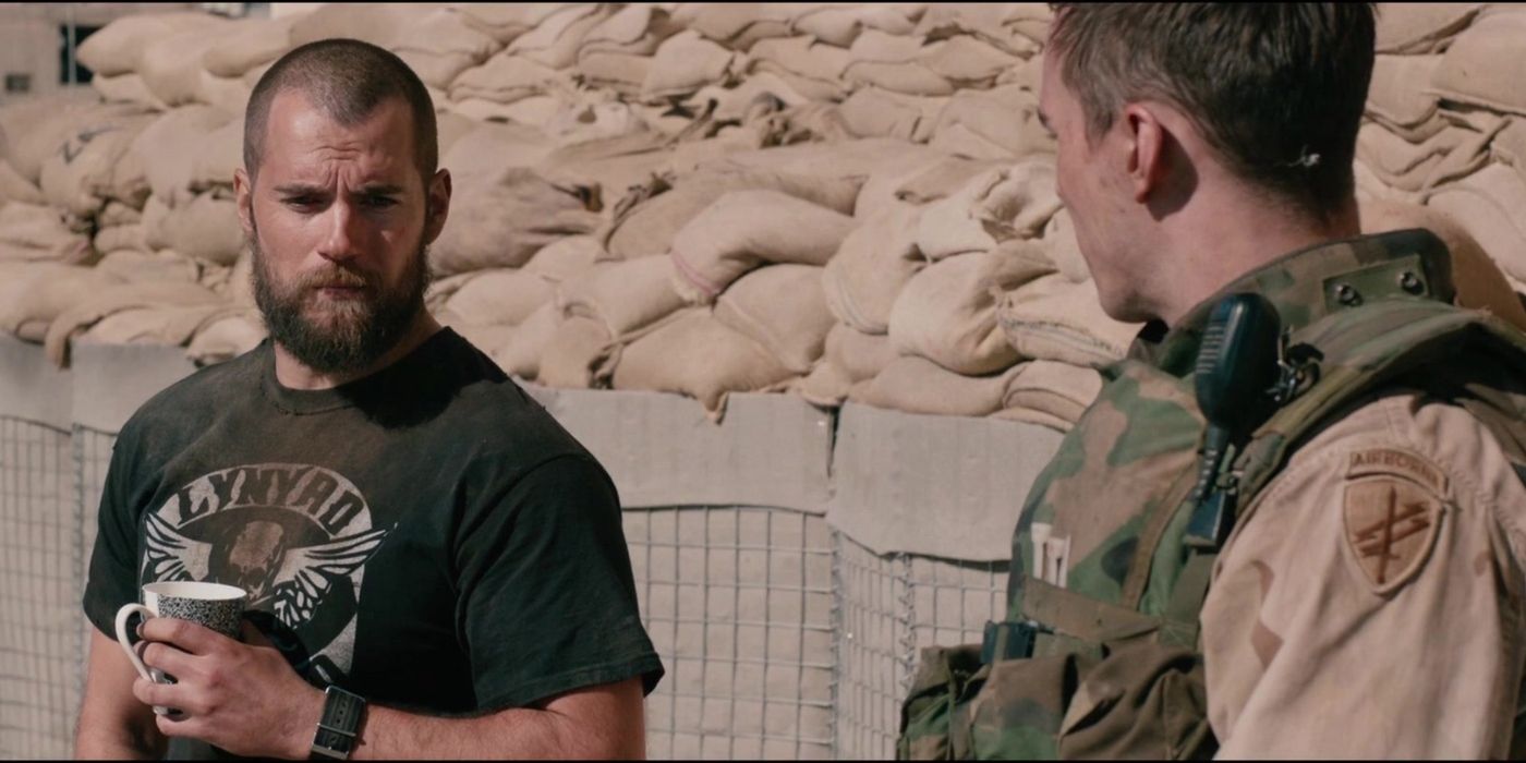 Captain Syverson (Henry Cavill) and Matt Ocre (Nicholas Hoult) talking next to a mound of sandbags in Sand Castle