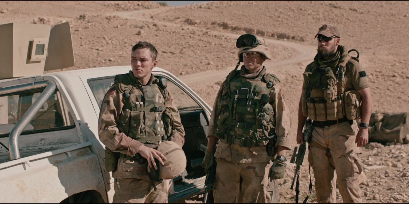 Pvt. Matt Ocre (Nicholas Hoult), Sgt. Harper (Logan Marshall-Green) and Cpt. Syverson standing in the desert in Sand Castle