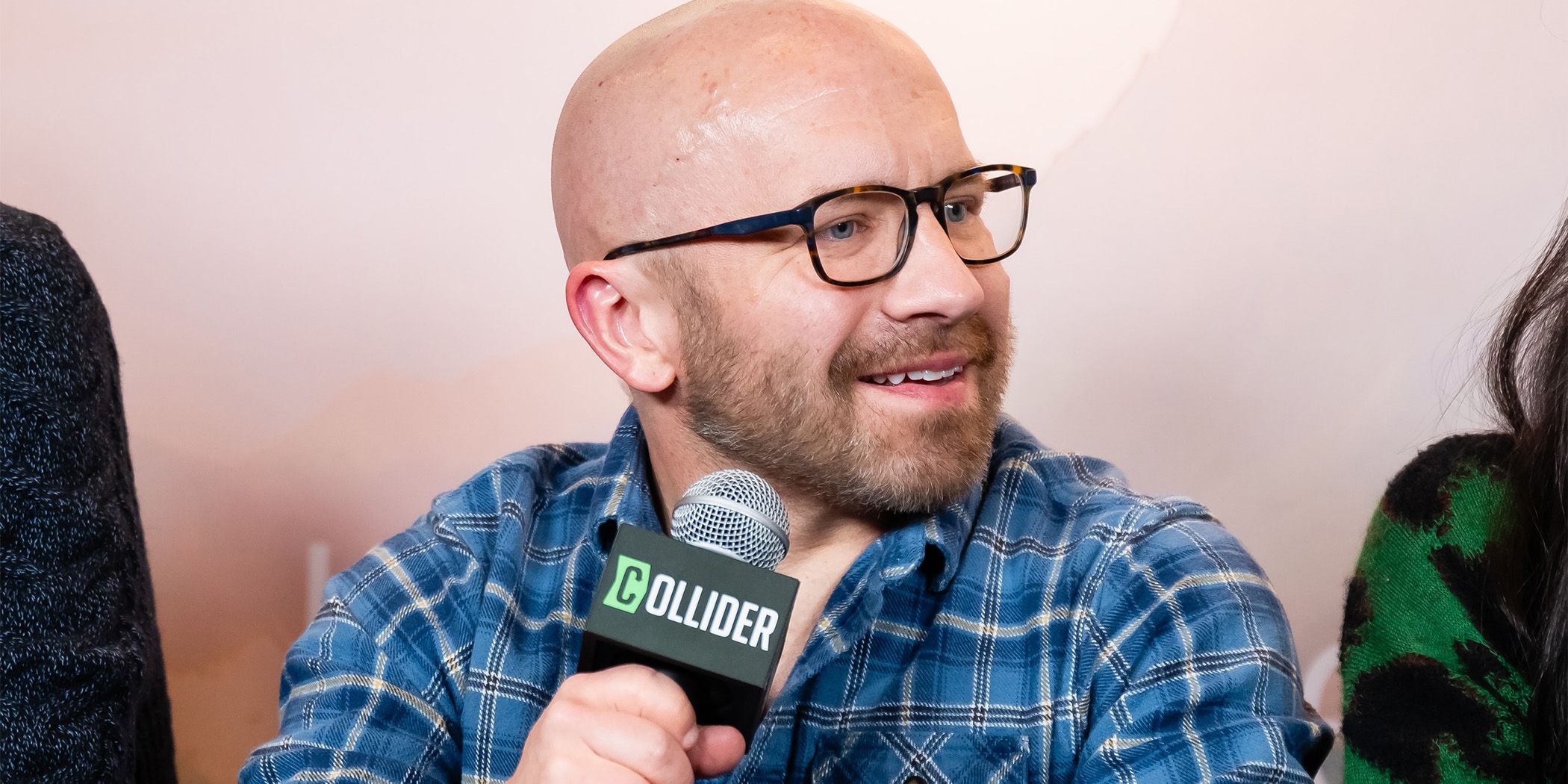 Sasquatch Sunset's Christophe Zajac-Denek smiling in an interview at Sundance 2024