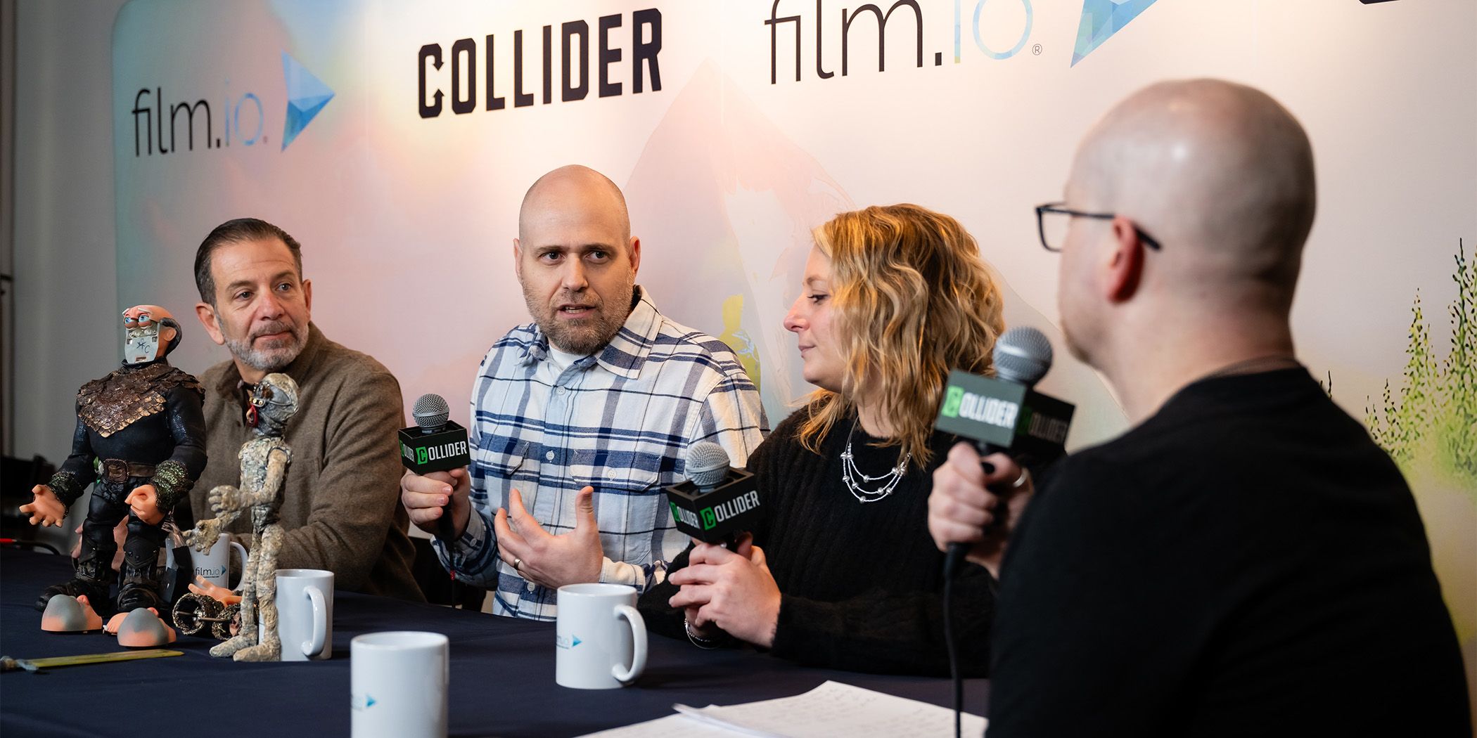 Nathan Smith (center) talking about Saurus City while Richard Joel (left) and Lauren Magura (right) listen at Sundance 2024