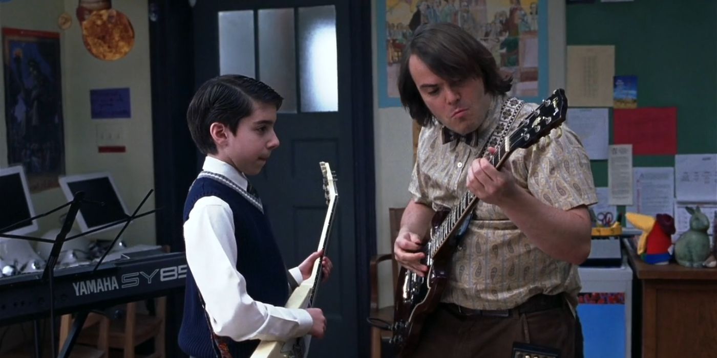 Dewey (right) teaches Zack (left) to play the guitar