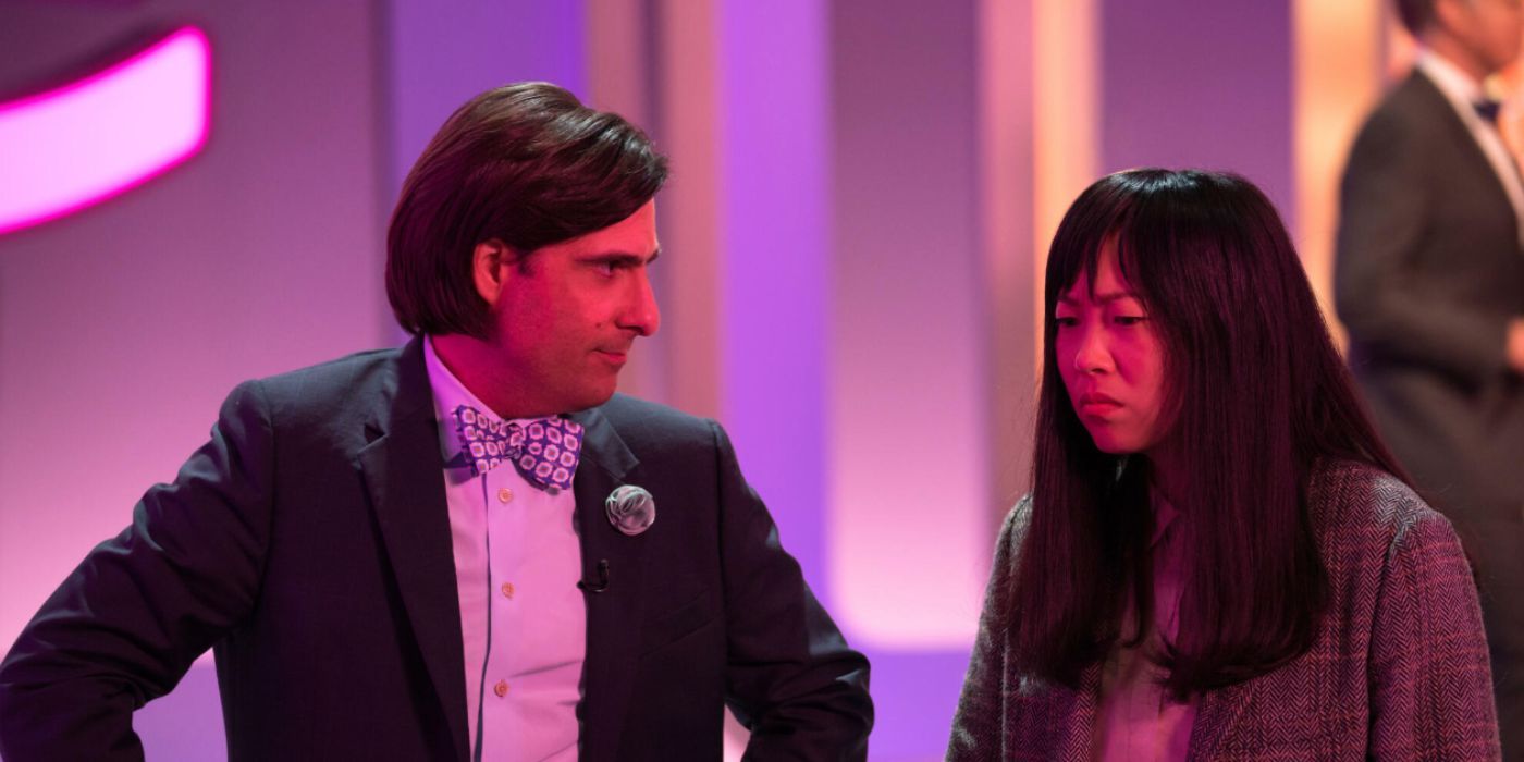 Jason Schwartzman and Awkwafina as Ron Heacock and Anne Yumm on game show in 'Quiz Lady'