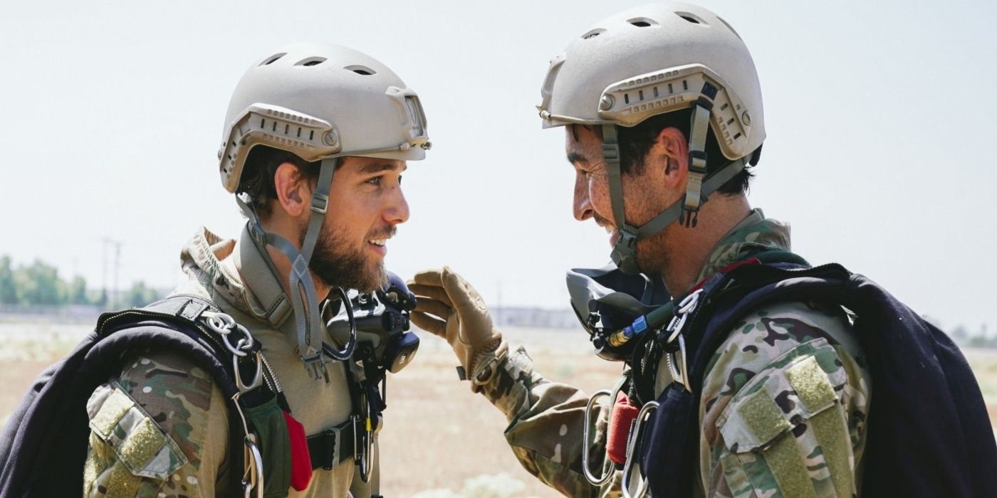 Clay Spenser (Max Thieriot) and Brian Armstrong (Jay Hayden) smiling at one another in SEAL Team