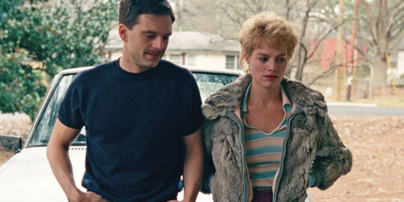 Jeff Gillooly and Tonya Harding standing together in a driveway in 'I, Tonya'