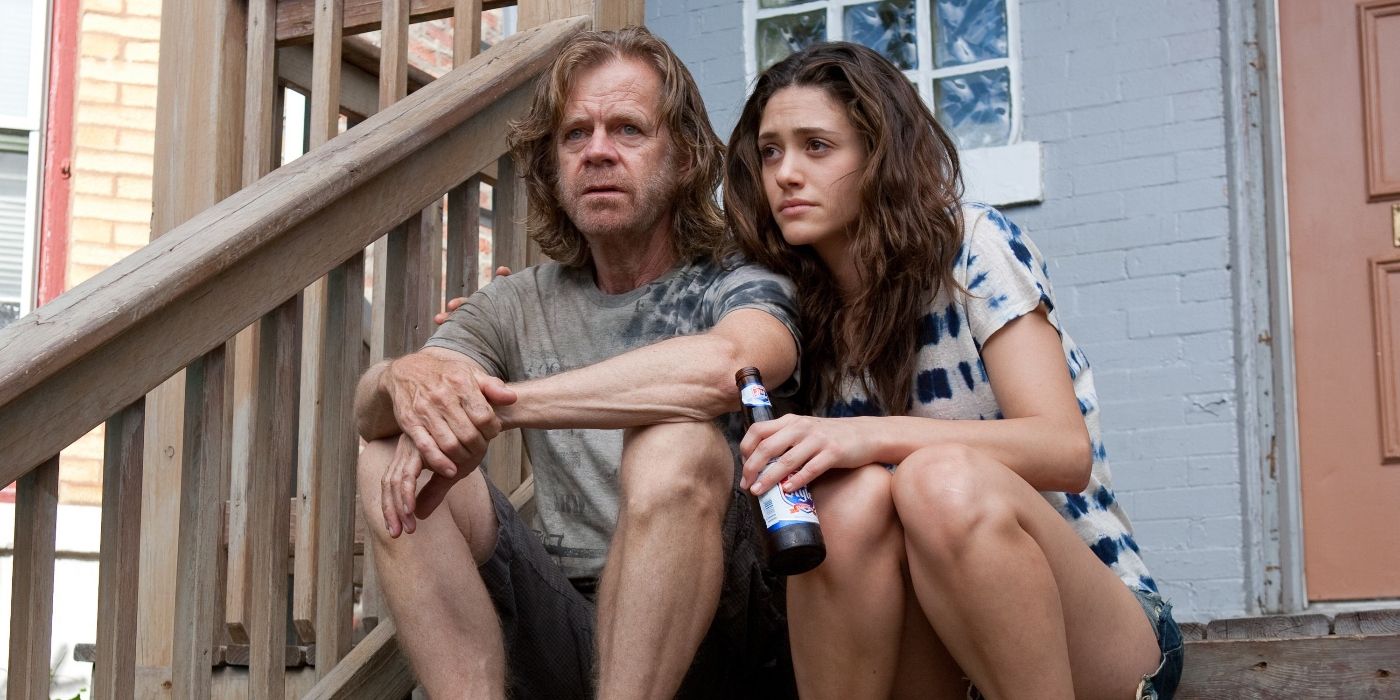 Fiona and Frank Gallagher (Emmy Rossum and William H. Macy) sit on their front steps, looking sad on Shameless