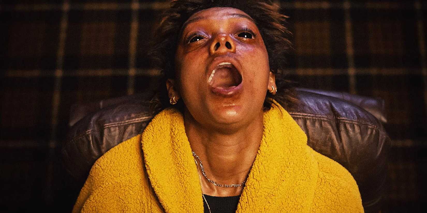Sophie Wilde with mouth open and pitch black eyes while being possessed by a spirit in Talk to Me.