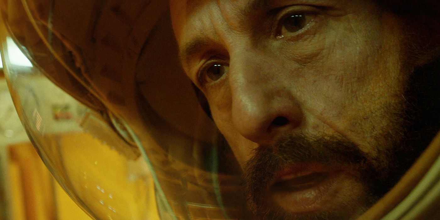 A close-up of Adam Sandler in a space suit