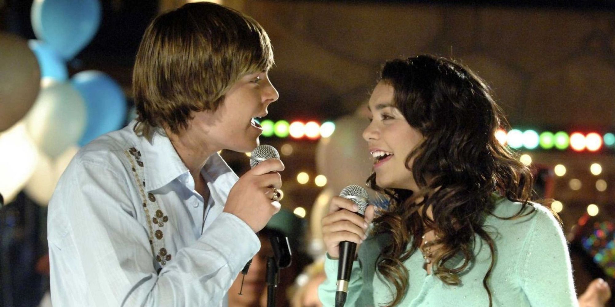 Zac Efron as Troy Bolton singing with Vanessa Hudgens as Gabriela Montez in High School Musical