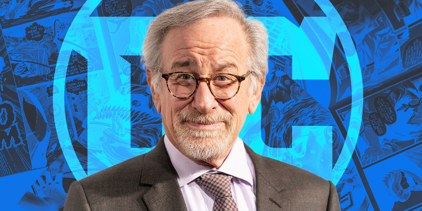 Steven Spielberg in fron of a DC Comics logo