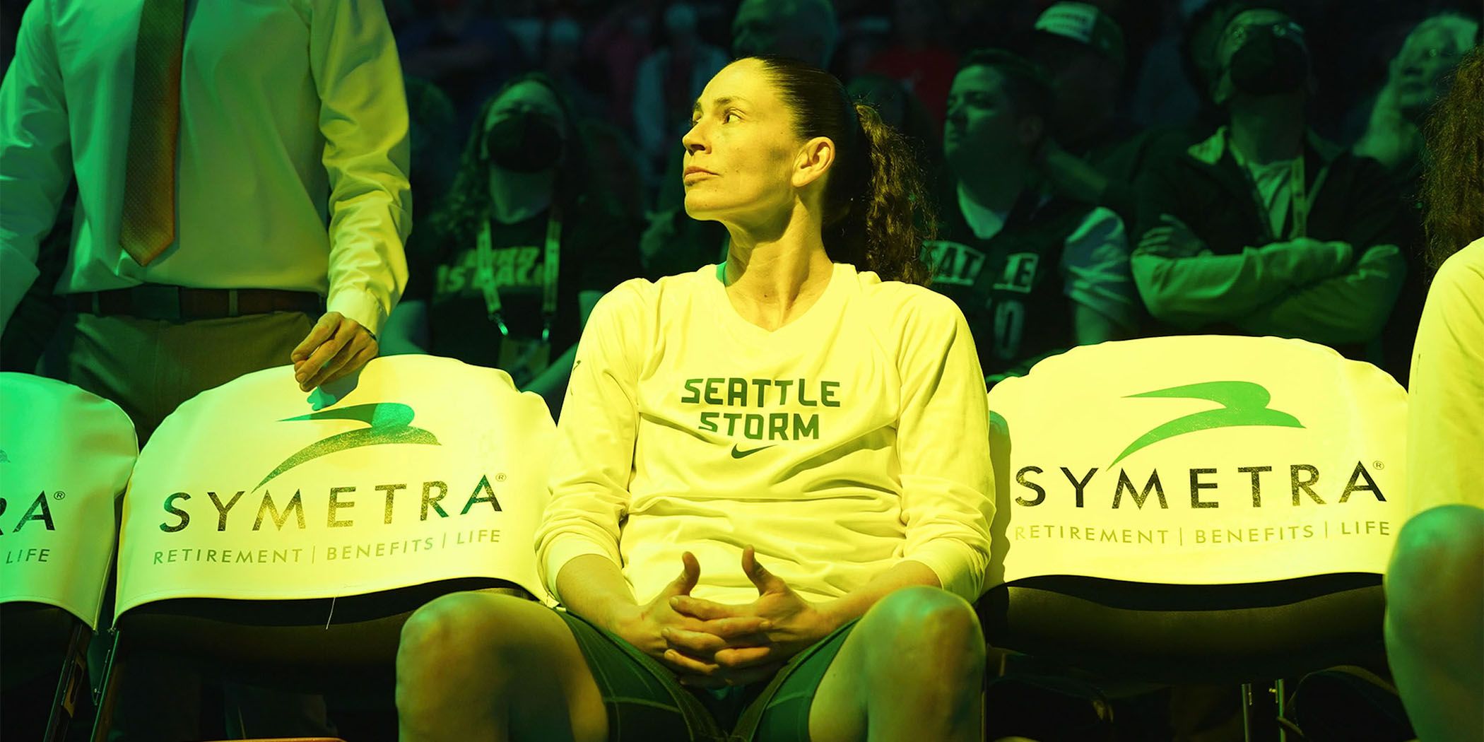 Sue Bird sitting at a basketball game in Sue Bird: In the Clutch for Sundance 2024. 