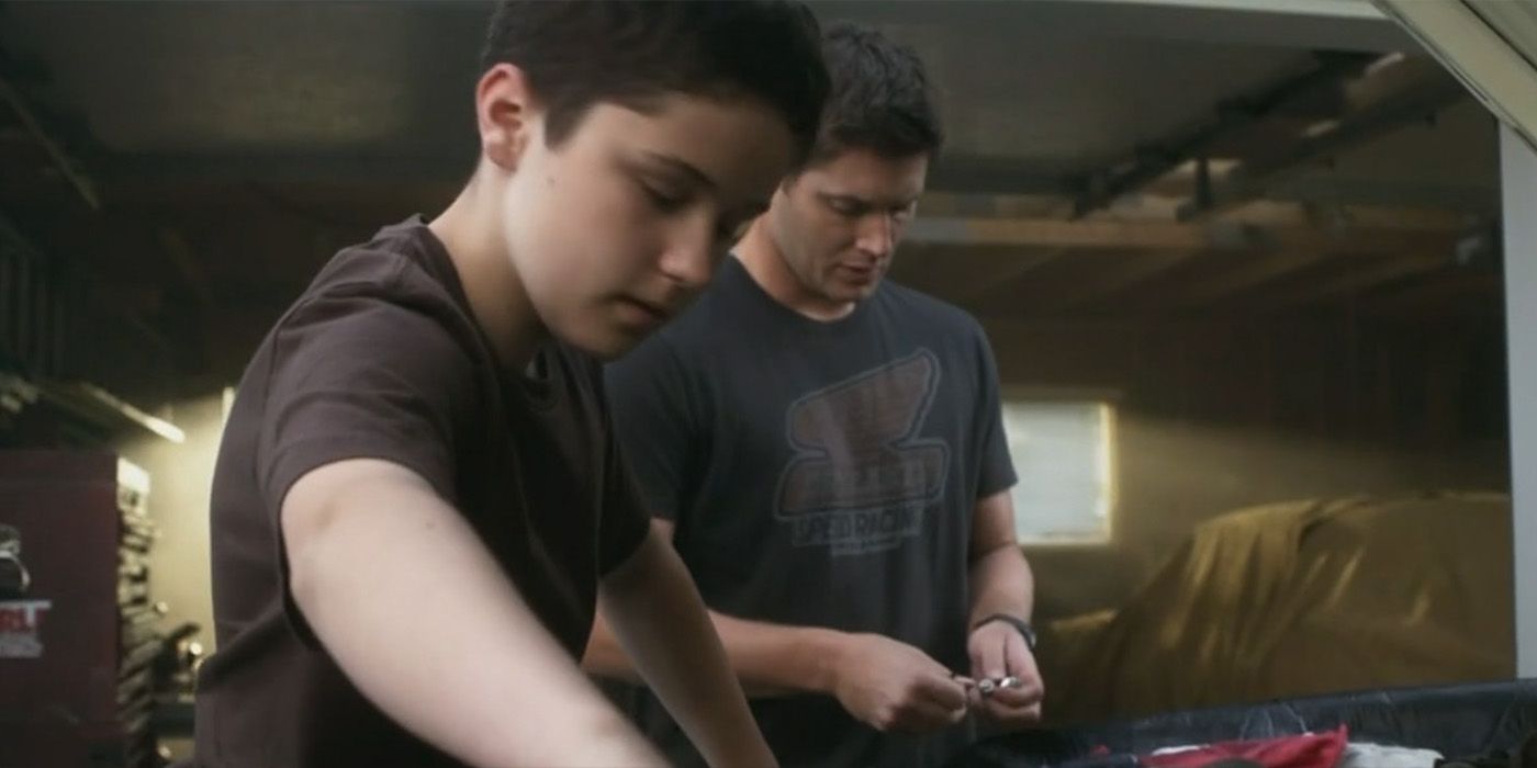 Dean (Jensen Ackles) teaches Ben Braeden (Nicholas Elia) how to fix a car on 'Supernatural'