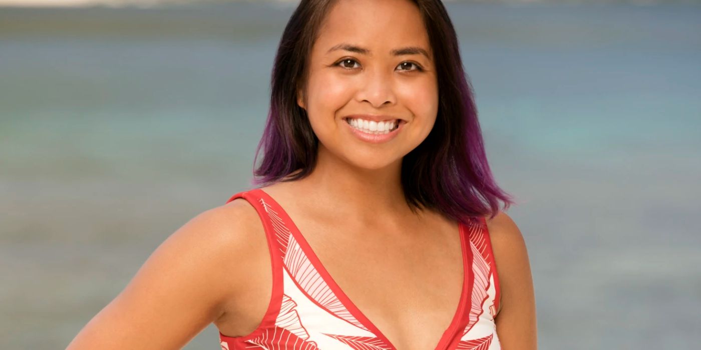 Erica Casupanan in red tank top and purple hair smiling in Survivor promo