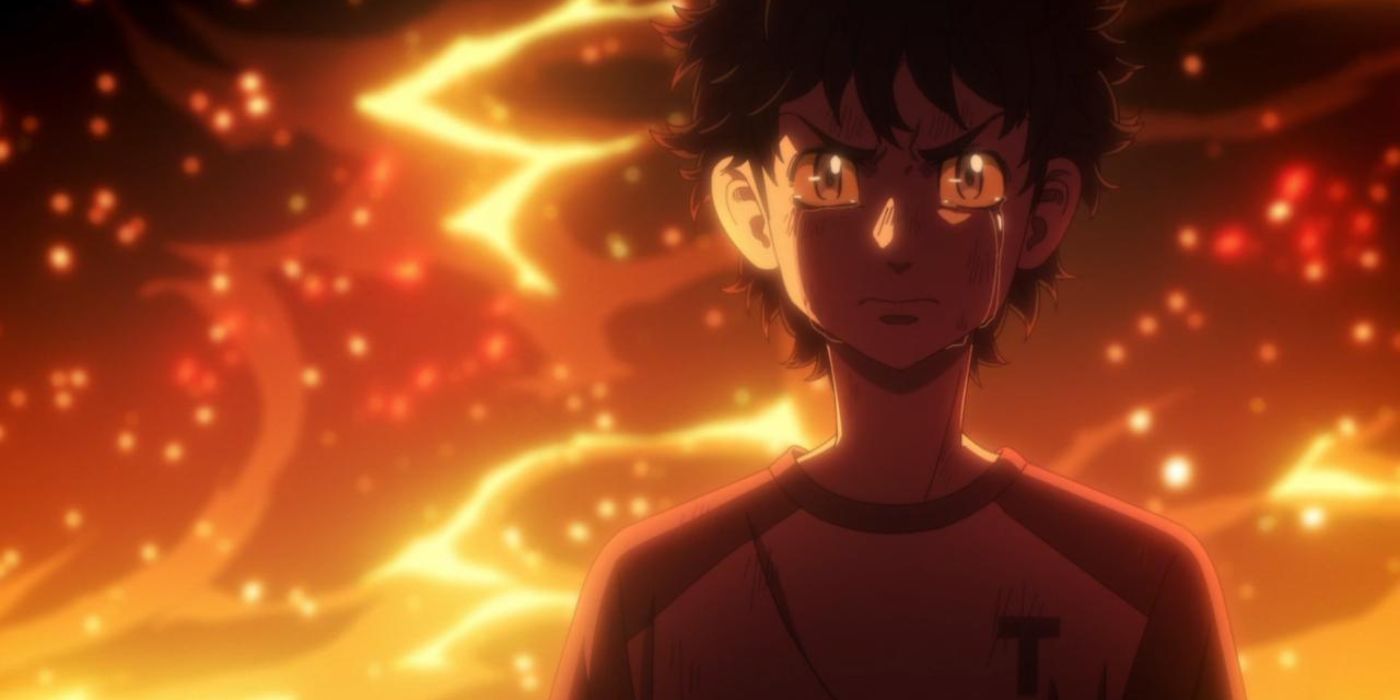 Takemichi standing in front of a fire seriously in Tokyo Revengers