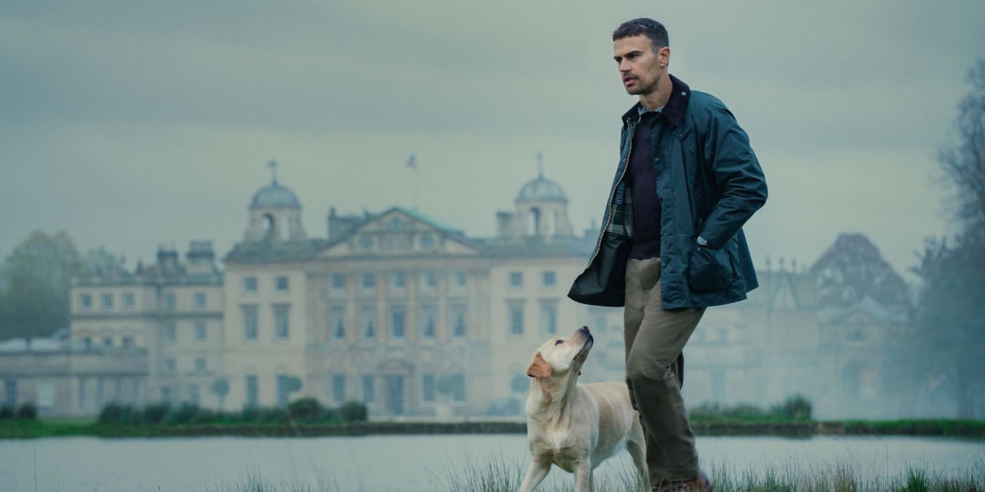 Theo James as Eddie Halstead, walking with a dog outside a mansion, in The Gentlemen