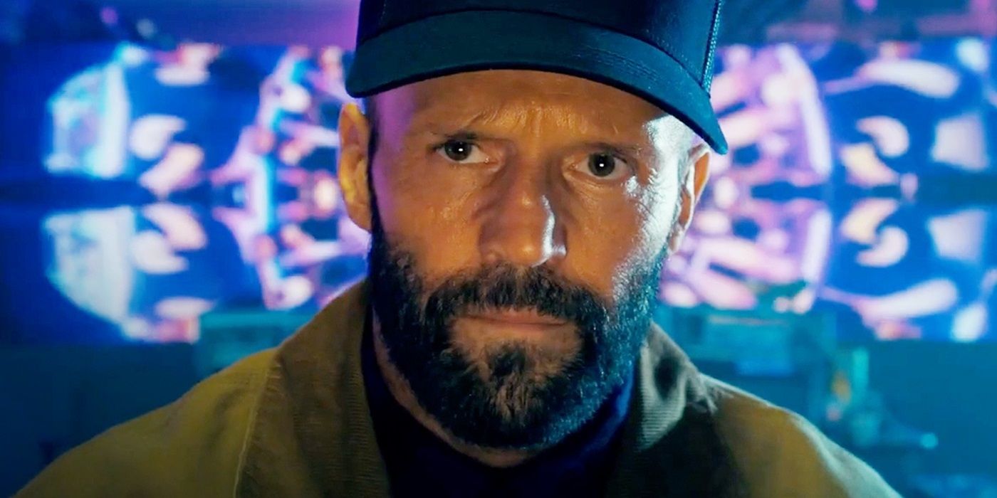 Jason Statham as Adam Clay staring at a person offscreen in The Beekeeper